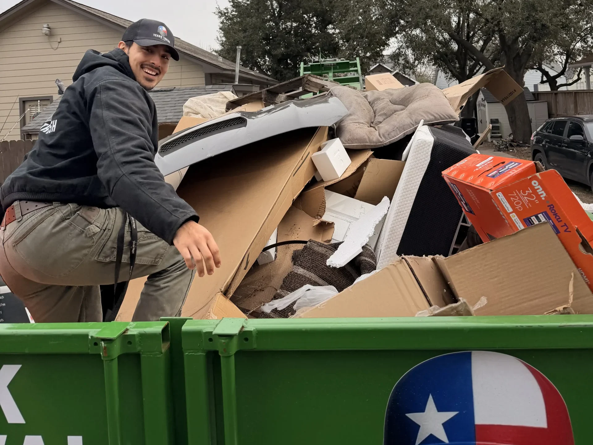 Man On Truck doing Junk Removal